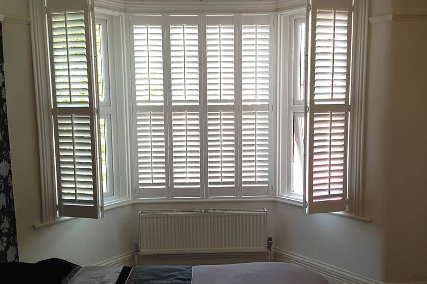 dressing bay windows with shutters 1